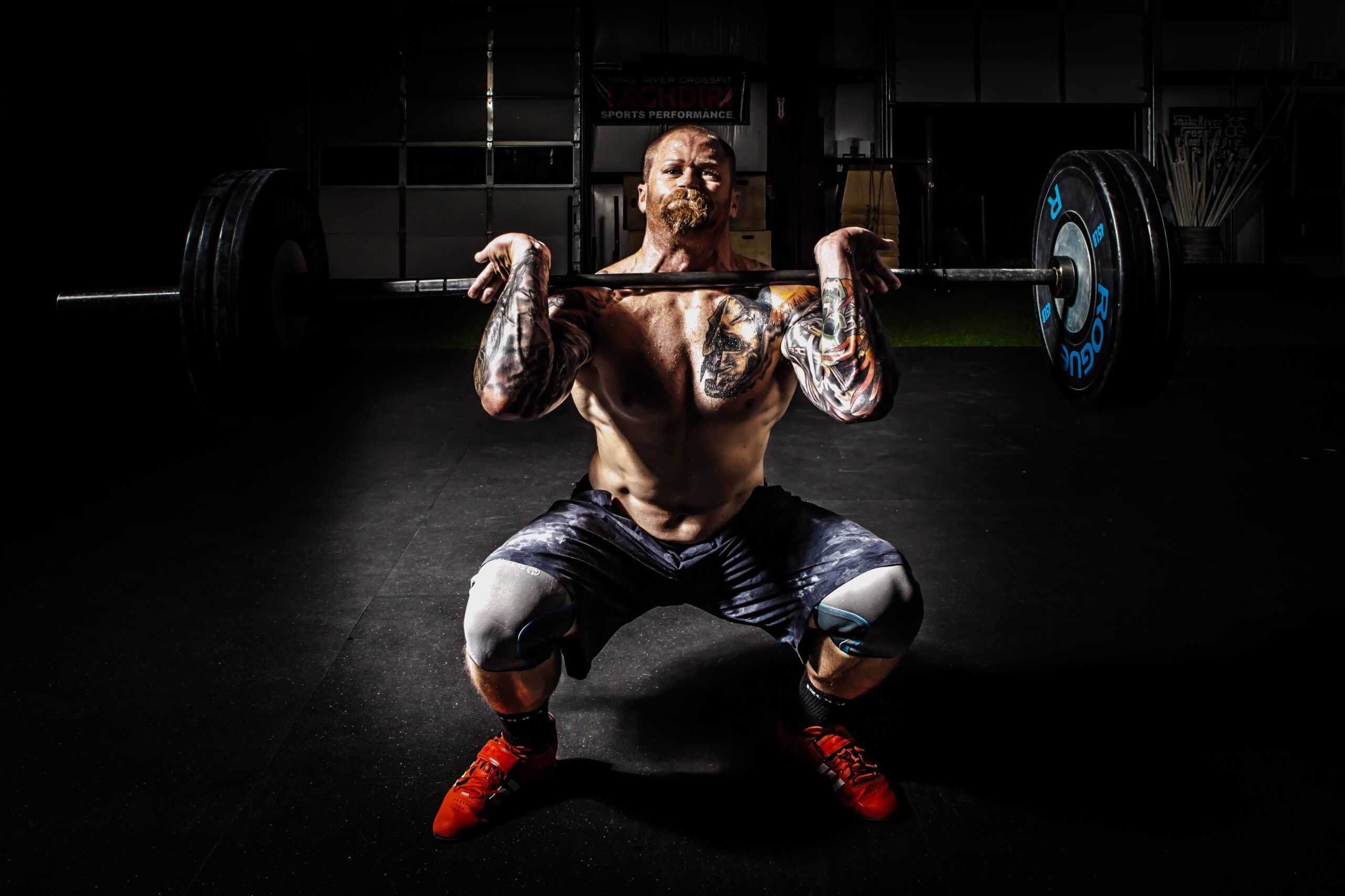 Exercise Ideas, Strong muscular man doing front squats